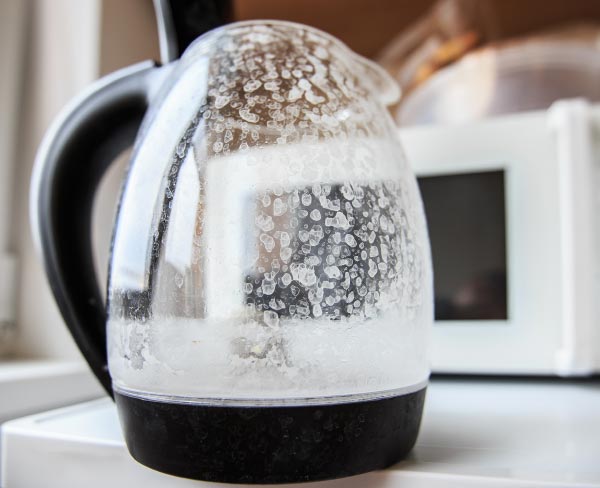 Hard water built up on a coffee pot